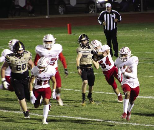 Wellington Skyrocket Brenden Garcia (1) gains yards in Quanah territory, where Wellington shutout the Indians in 48-0 final Friday, Oct. 27. Blocking for Garcia were Noah Cantu (22), Dalton Holland (73), Kaseten Welch (54) and Caleb Strickland (50). The Red River Sun/Shauna Salinas