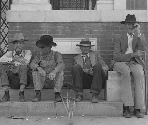 A photograph, by Dorothea Lange, of a meeting of the “Spit and Whittle” club on the steps of the bank in downtown Memphis in 1938. The bank still stands, and it would be cool to try to recreate this photo. I wonder if any stories ever got the Texas Tall Tale treatment when these gentlemen assembled. Looking at the man on the far right, my feeling is that he was an old-time trail cowboy. He’s the right age, and he has just the right look about him.