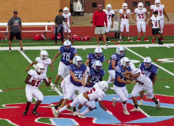 Junior varsity (JV) Skyrocket Dalton Holland (52) takes down a Lubbock Christian Eagle as other Rockets Fabian Moreno (65), TJ Salinas (11), Miguel Rincon (5) and Yobani Moreno (77) assist during the Rockets’ 5016 win last Thursday, Sept. 1 in Lubbock. The Red River Sun/Shauna Salinas